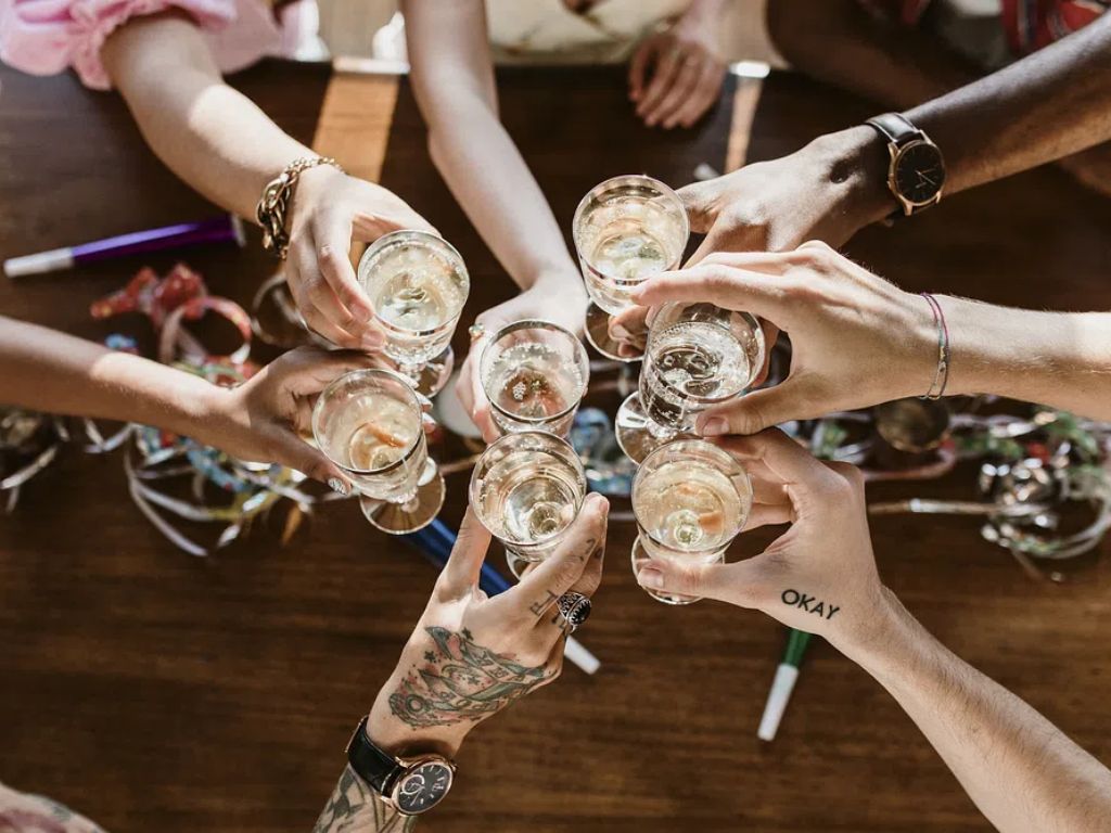 A group of diverse friends toasting at a party