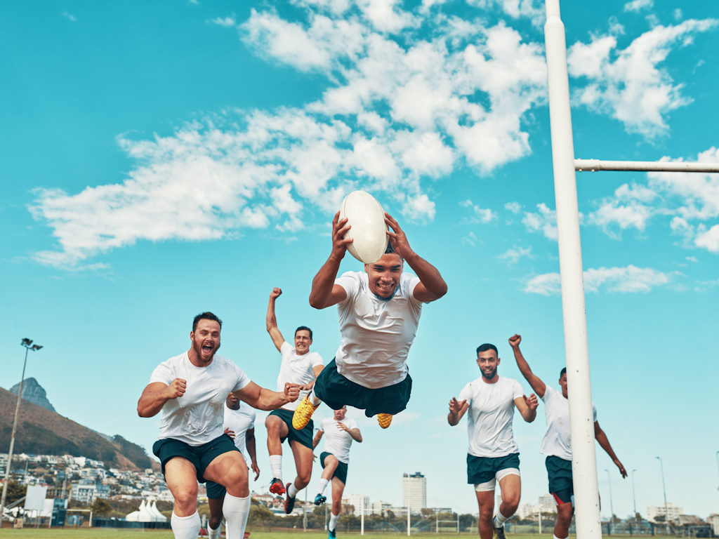 corporate groups in sydney rugby player scoring while playing field