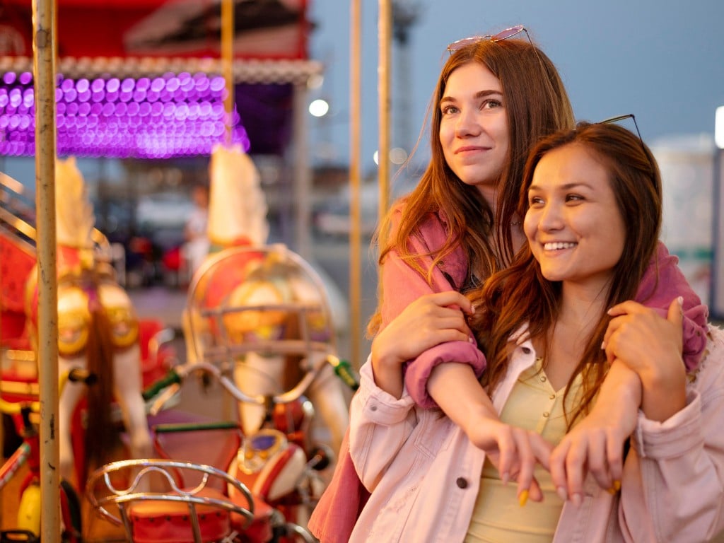 Friends enjoying rides at Luna Park Sydney during Christmas.